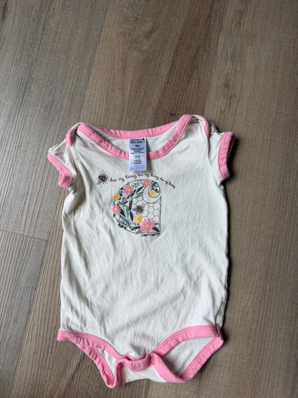Carhartt Cream One-Piece Bodysuit with Pink Trim and Floral Bee Graphic